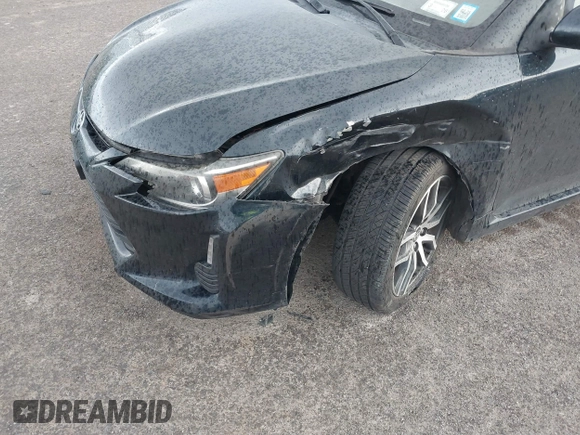2015 Scion tC with VIN JTKJF5C7XFJ001662, listed as a IAAI auction lot 41843123 with 128,851 mi miles. Bid and sale history available at carsss.com. Image 6.