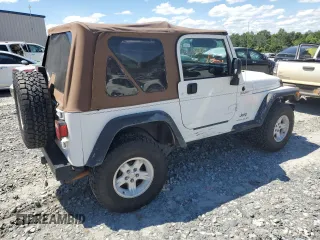 2004 Jeep Wrangler Sport with VIN 1J4FA49S94P751849, listed as a Copart auction lot 55519445 with 139,854 mi miles and Salvage title. Bid and sale history available at DreamBid. Image 3.
