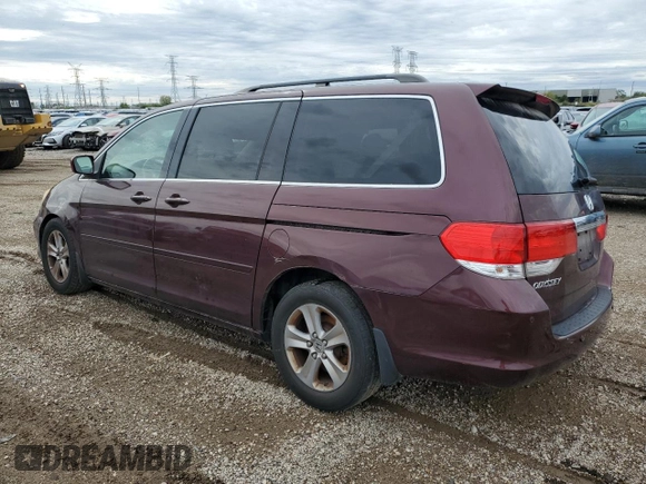 2010 Honda Odyssey Touring with VIN 5FNRL3H94AB056657, listed as a Copart auction lot 72658934 with 202,690 mi miles and Salvage title. Bid and sale history available at DreamBid. Image 2.