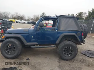2003 Jeep Wrangler X with VIN 1J4FA39S23P300447, listed as a IAAI auction lot 41791733 with 165,576 mi miles. Bid and sale history available at carsss.com. Image 14.