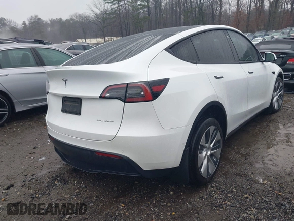 2021 Tesla Model Y Long Range with VIN 5YJYGDEEXMF228914, listed as a IAAI auction lot 41409806 with 48,276 mi miles. Bid and sale history available at carsss.com. Image 4.