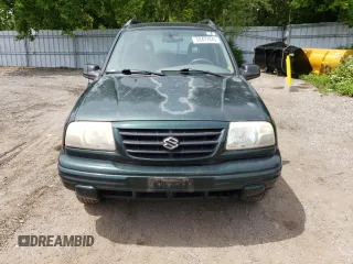 2003 Suzuki Vitara JLX z VIN 2S3TD52V136101732, wystawiony jako Copart lot #58477845 z przebiegiem 105 628 mil mil oraz Czysty tytuł • Clean title. Historia ofert i sprzedaży dostępna na DreamBid. Obrazek 5.