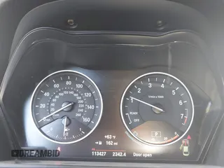 2015 BMW 2 Series 228i xDrive with VIN WBA1F7C5XFV367287, listed as a IAAI auction lot 40802463 with 113,427 mi miles and . Bid and sale history available at carsss.com. Image 7.