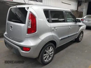 2012 Kia Soul + with VIN KNDJT2A66C7403146, listed as a IAAI auction lot 42003669 with 142,522 mi miles. Bid and sale history available at carsss.com. Image 4.