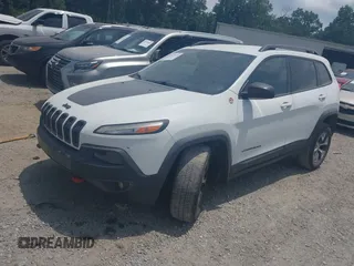 2015 Jeep Cherokee Trailhawk z VIN 1C4PJMBS3FW511564, wystawiony jako IAAI lot #42424468 z przebiegiem 169 167 mil mil oraz . Historia ofert i sprzedaży dostępna na DreamBid. Obrazek 18.