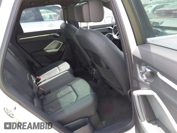 2021 Audi Q3 Premium with VIN WA1AUCF33M1096437, listed as a IAAI auction lot 41910411 with 86,837 mi miles and . Bid and sale history available at DreamBid. Image 8.