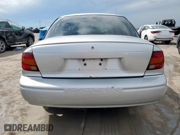2002 Saturn SL с VIN 1G8ZH52892Z242469, выставлен на аукционе Copart как лот 59973755 с пробегом Не указан миль и Списание • Salvage title. История ставок и продаж доступна на DreamBid. Изображение 6.