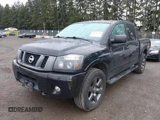 2012 Nissan Titan SV with VIN 1N6BA0EJ0CN303050, listed as a IAAI auction lot 41892370 with 120,018 mi miles. Bid and sale history available at carsss.com. Image 2.