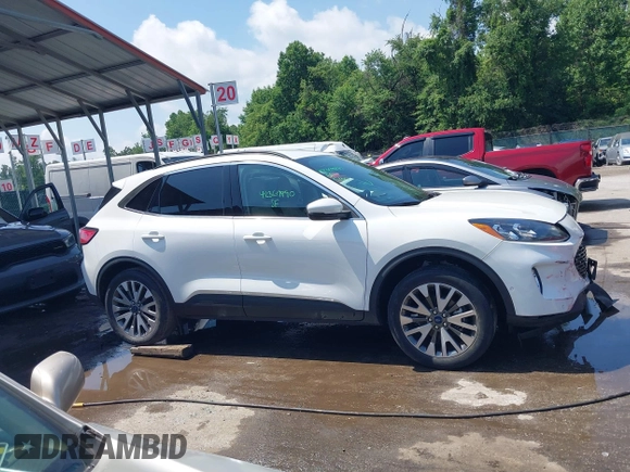 2020 Ford Escape Titanium z VIN 1FMCU9J90LUA39747, wystawiony jako IAAI lot #42369890 z przebiegiem 31 425 mil mil oraz . Historia ofert i sprzedaży dostępna na DreamBid. Obrazek 13.
