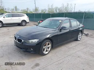 2015 BMW 3 Series 328i with VIN WBA3A5G57FNS87368, listed as a IAAI auction lot 42132939 with 115,289 mi miles. Bid and sale history available at carsss.com. Image 2.