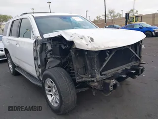 2019 Chevrolet Tahoe LT z VIN 1GNSKBKC5KR273544, wystawiony jako IAAI lot #42085800 z przebiegiem 99 537 mil mil oraz . Historia ofert i sprzedaży dostępna na DreamBid. Obrazek 1.