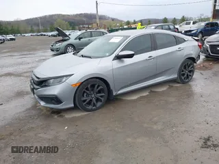 2019 Honda Civic Sport with VIN 19XFC2F81KE034047, listed as a IAAI auction lot 41995614 with 91,303 mi miles and . Bid and sale history available at DreamBid. Image 18.