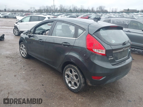 2011 Ford Fiesta SES with VIN 3FADP4FJ7BM111381, listed as a IAAI auction lot 41226251 with 93,694 mi miles. Bid and sale history available at carsss.com. Image 3.