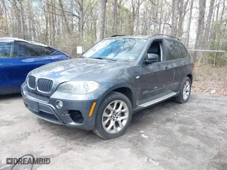 2011 BMW X5 35i with VIN 5UXZV4C56BL406632, listed as a IAAI auction lot 41981590 with 168,534 mi miles. Bid and sale history available at carsss.com. Image 2.
