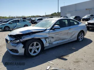 2014 BMW 4 Series 428i xDrive with VIN WBA3N5C51EF716572, listed as a Copart auction lot 52086365 with 209,742 mi miles and Salvage Title. Bid and sale history available at carsss.com. Image 1.