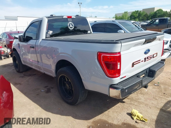 2023 Ford F-150 XL with VIN 1FTMF1C53PKF34184, listed as a IAAI auction lot 42242703 with 27,312 mi miles and . Bid and sale history available at DreamBid. Image 3.