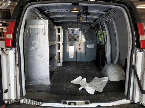 2014 Chevrolet Express Cargo with VIN 1GCSGAFX5E1204664, listed as a IAAI auction lot 42566613 with 103,962 mi miles and . Bid and sale history available at DreamBid. Image 3.