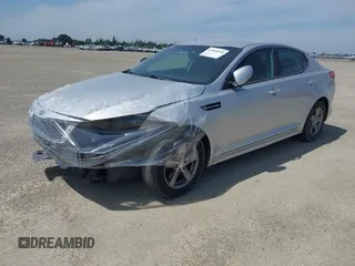2015 Kia Optima LX with VIN 5XXGM4A74FG381316, listed as a IAAI auction lot 41885940 with 128,984 mi miles. Bid and sale history available at carsss.com. Image 2.