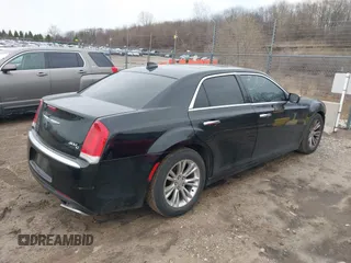 2016 Chrysler 300 with VIN 2C3CCAEG0GH348651, listed as a IAAI auction lot 41967981 with 141,728 mi miles. Bid and sale history available at carsss.com. Image 4.