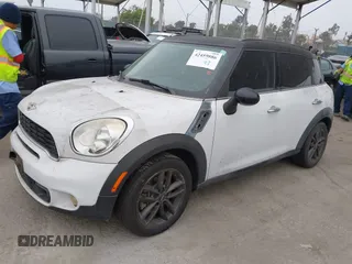 2011 MINI Countryman S with VIN WMWZC3C52BWL78647, listed as a IAAI auction lot 42459886 with 142,407 mi miles and . Bid and sale history available at DreamBid. Image 2.