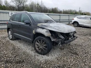2015 Volkswagen Tiguan SE z VIN WVGBV7AXXFW606017, wystawiony jako Copart lot #51005745 z przebiegiem Nie podano mil oraz Szkoda całkowita • Salvage title. Historia ofert i sprzedaży dostępna na DreamBid. Obrazek 4.