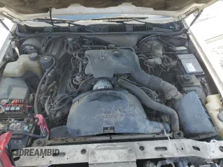 1996 Lincoln Town Car Executive z VIN 1LNLM81W4TY641611, wystawiony jako Copart lot #44939405 z przebiegiem 296 702 mil mil oraz Szkoda całkowita • Salvage title. Historia ofert i sprzedaży dostępna na DreamBid. Obrazek 11.
