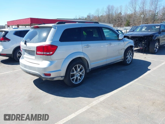 2014 Dodge Journey SXT z VIN 3C4PDCBG7ET227470, wystawiony jako IAAI lot #41843128 z przebiegiem 98 195 mil mil oraz . Historia ofert i sprzedaży dostępna na DreamBid. Obrazek 4.