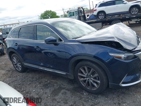 2021 Mazda CX-9 Grand Touring with VIN JM3TCBDY3M0537975, listed as a IAAI auction lot 42251894 with 50,156 mi miles and . Bid and sale history available at DreamBid. Image 13.