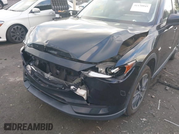 2018 Mazda CX-5 Touring z VIN JM3KFACM3J1435089, wystawiony jako IAAI lot #41130041 z przebiegiem 80 446 mil mil oraz . Historia ofert i sprzedaży dostępna na DreamBid. Obrazek 6.