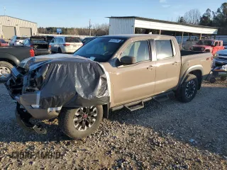 2022 Nissan Frontier Pro-4X z VIN 1N6ED1EK4NN611473, wystawiony jako Copart lot #89142785 z przebiegiem 24 871 mil mil oraz Szkody całkowita. Historia ofert i sprzedaży dostępna na DreamBid. Obrazek 1.