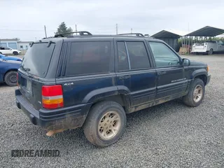 1998 Jeep Grand Cherokee Limited with VIN 1J4GZ78YXWC141912, listed as a IAAI auction lot 41972948 with 291,801 mi miles. Bid and sale history available at carsss.com. Image 4.