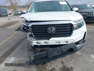 2023 Honda Ridgeline RTL with VIN 5FPYK3F55PB018188, listed as a IAAI auction lot 41952319 with 73,019 mi miles and . Bid and sale history available at DreamBid. Image 6.