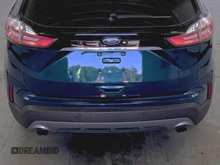 2020 Ford Edge Titanium z VIN 2FMPK3K91LBB37761, wystawiony jako IAAI lot #42829390 z przebiegiem 90 117 mil mil oraz . Historia ofert i sprzedaży dostępna na DreamBid. Obrazek 6.