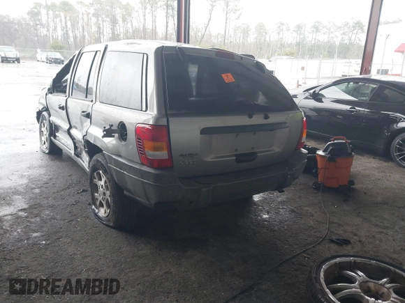 2001 Jeep Grand Cherokee Laredo with VIN 1J4GX48S51C708990, listed as a IAAI auction lot 41656323 with 198,124 mi miles and . Bid and sale history available at DreamBid. Image 3.