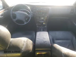 1998 Infiniti Q45 z VIN JNKBY31A9WM400536, wystawiony jako Copart lot #77225484 z przebiegiem 136 342 mil mil oraz Szkody całkowita. Historia ofert i sprzedaży dostępna na DreamBid. Obrazek 8.