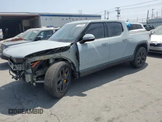 2023 Rivian R1T Adventure z VIN 7FCTGAAAXPN022181, wystawiony jako Copart lot #51124045 z przebiegiem 27 745 mil mil oraz Szkoda całkowita • Salvage title. Historia ofert i sprzedaży dostępna na DreamBid. Obrazek 1.