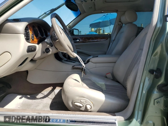 1999 Jaguar XJ with VIN SAJHX604XXC854217, listed as a Copart auction lot 56042735 with 127,092 mi miles and Salvage title. Bid and sale history available at DreamBid. Image 7.