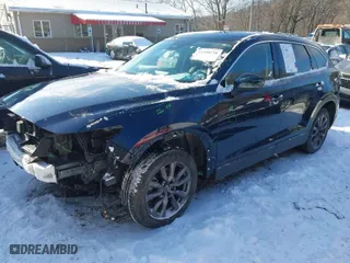 2021 Mazda CX-9 Touring with VIN JM3TCBCY3M0510194, listed as a IAAI auction lot 41340118 with 65,902 mi miles. Bid and sale history available at carsss.com. Image 2.