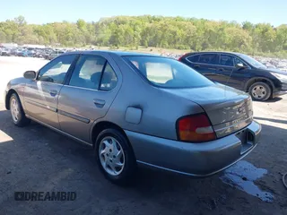 1999 Nissan Altima XE with VIN 1N4DL01D5XC124936, listed as a IAAI auction lot 42031611 with 140,519 mi miles. Bid and sale history available at carsss.com. Image 3.