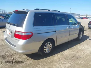 2005 Honda Odyssey EX-L with VIN 5FNRL38725B098992, listed as a IAAI auction lot 41639045 with 230,257 mi miles. Bid and sale history available at carsss.com. Image 4.