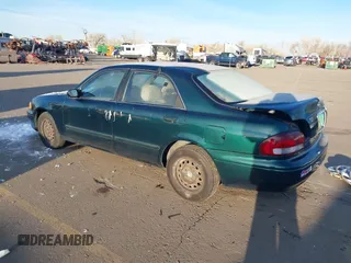 1998 Mazda 626 DX with VIN 1YVGF22C9W5721679, listed as a IAAI auction lot 41287224 with 134,384 mi miles. Bid and sale history available at carsss.com. Image 3.