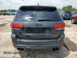 2018 Jeep Grand Cherokee Trackhawk with VIN 1C4RJFN99JC309254, listed as a Copart auction lot 64061615 with 104,558 mi miles and Clean title. Bid and sale history available at DreamBid. Image 6.