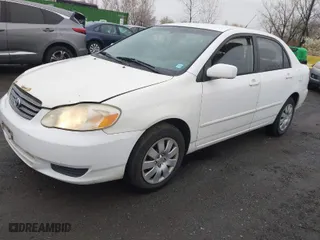 2004 Toyota Corolla CE with VIN 1NXBR32E34Z335238, listed as a IAAI auction lot 41987476 with 124,999 mi miles. Bid and sale history available at carsss.com. Image 2.