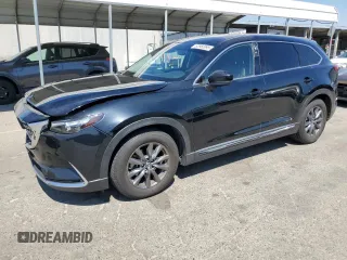 2021 Mazda CX-9 Touring with VIN JM3TCACY8M0502294, listed as a Copart auction lot 62950995 with 76,810 mi miles and Salvage title. Bid and sale history available at DreamBid. Image 1.