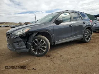 2016 Mazda CX-5 Grand Touring z VIN JM3KE4DY0G0633861, wystawiony jako Copart lot #47748645 z przebiegiem 112 219 mil mil oraz Szkoda całkowita • Salvage title. Historia ofert i sprzedaży dostępna na DreamBid. Obrazek 1.