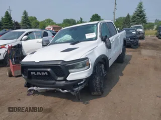 2022 Ram 1500 Rebel with VIN 1C6SRFLT5NN318494, listed as a IAAI auction lot 42413194 with 59,458 mi miles and . Bid and sale history available at DreamBid. Image 6.