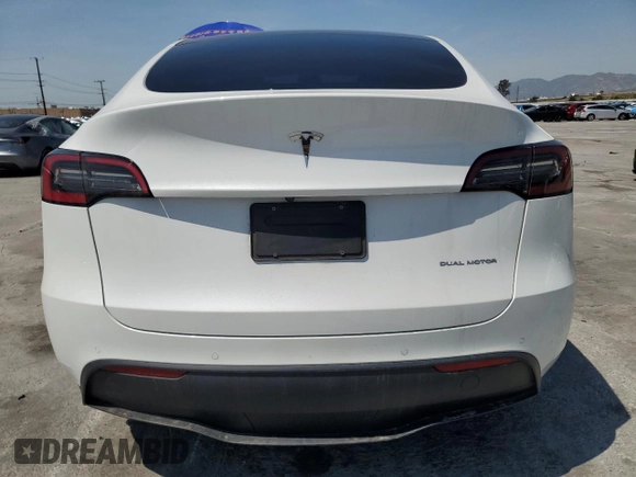 2022 Tesla Model Y Long Range z VIN 7SAYGDEE2NF513823, wystawiony jako Copart lot #51174795 z przebiegiem 28 143 mil mil oraz Szkody całkowita. Historia ofert i sprzedaży dostępna na DreamBid. Obrazek 6.