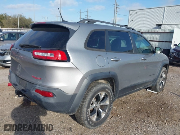 2015 Jeep Cherokee Trailhawk with VIN 1C4PJMBS3FW662307, listed as a IAAI auction lot 41778932 with 64,569 mi miles. Bid and sale history available at carsss.com. Image 4.