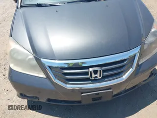 2010 Honda Odyssey Touring z VIN 5FNRL3H90AB085105, wystawiony jako IAAI lot #42142123 z przebiegiem Nie podano mil oraz . Historia ofert i sprzedaży dostępna na DreamBid. Obrazek 10.