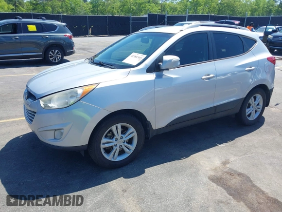 2013 Hyundai Tucson GLS with VIN KM8JU3AC3DU551018, listed as a IAAI auction lot 41988305 with 214,728 mi miles. Bid and sale history available at carsss.com. Image 17.